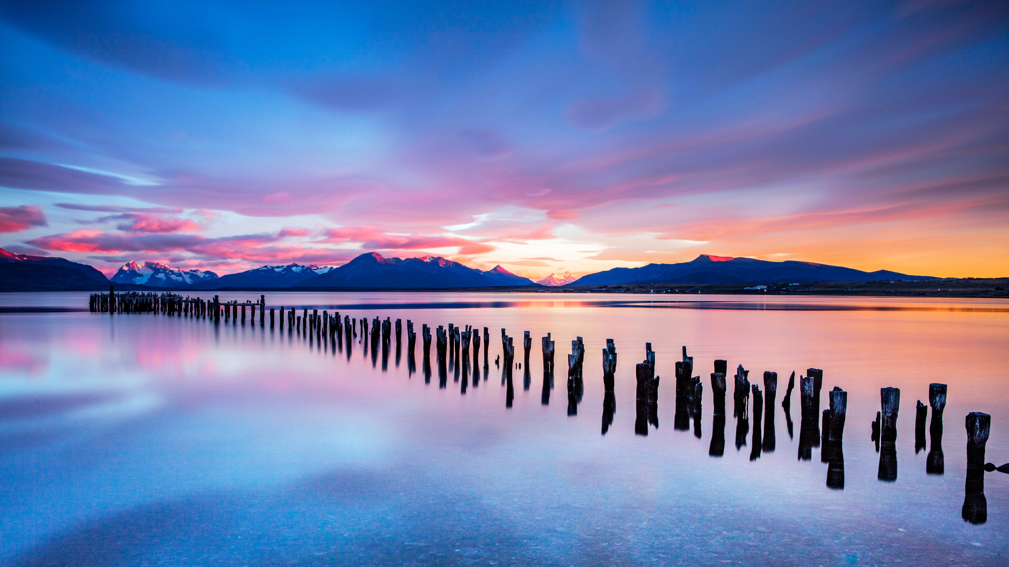 Experience the stunning beauty of Torres del Paine National Park in Chile with this breathtaking 4K wallpaper. The landscape scenery features snow-capped mountains, turquoise lakes, and rugged wilderness, perfect for nature enthusiasts and adventurers alike.