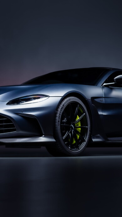 A high-quality 4K wallpaper featuring the iconic Aston Martin Vantage, a luxury sports car known for its sleek and elegant design, perfect for car enthusiasts and luxury car lovers.