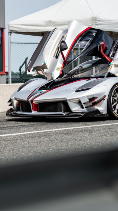 A high-resolution 4K wallpaper featuring the dynamic Ferrari FXX-K Evo, an exceptional sports car known for its superb performance and sleek design.