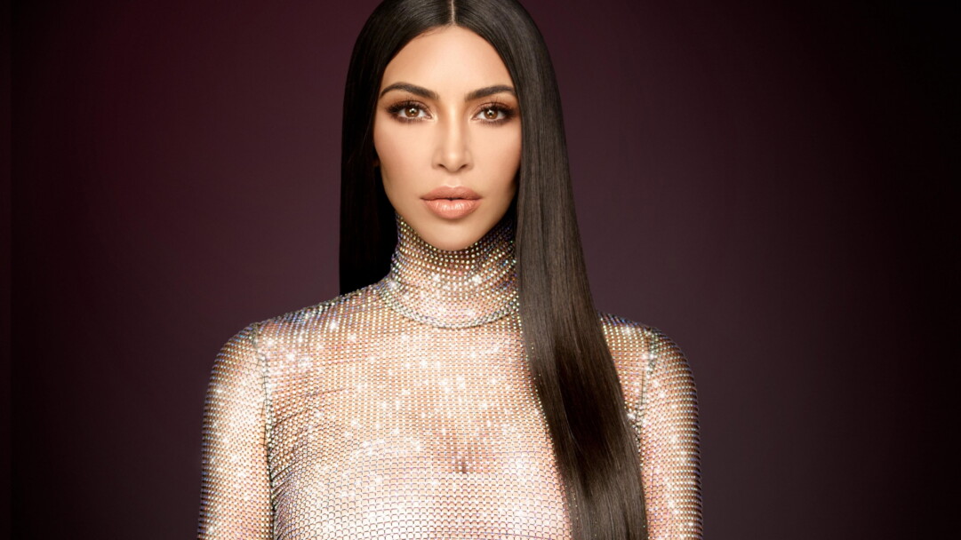 A glamorous 4K wallpaper featuring Kim Kardashian, a renowned celebrity known for her influence in fashion and entertainment, perfect for fans and admirers of her style and achievements.