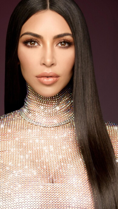 A glamorous 4K wallpaper featuring Kim Kardashian, a renowned celebrity known for her influence in fashion and entertainment, perfect for fans and admirers of her style and achievements.