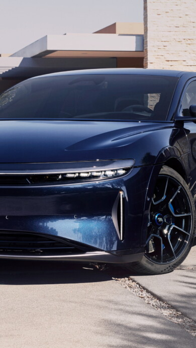 A luxurious 4K wallpaper featuring the Lucid Air in a captivating sapphire hue, highlighting the elegance of this high-end electric car's sleek design, perfect for enthusiasts and admirers of automotive excellence.