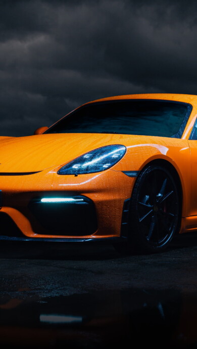 A high-quality 4K wallpaper featuring the Porsche Cayman GT4, a remarkable sports car known for its exceptional performance and sleek design, perfect for car enthusiasts and desktop customization.