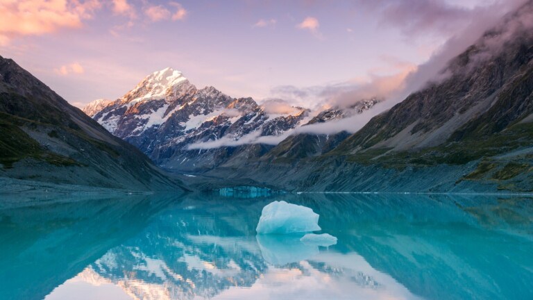 Immerse yourself in the serene beauty of Aoraki Mount Cook National Park in New Zealand with this captivating 4K wallpaper. The majestic Southern Alps and the tranquil landscape create a breathtaking and scenic escape. Perfect for travelers and those seeking a desktop background that captures the natural wonder and alpine serenity of this iconic national park.