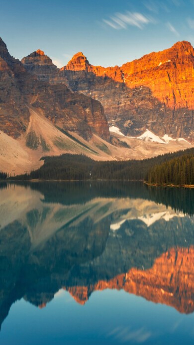 Immerse yourself in the natural beauty of Banff National Park in Canada with this stunning 4K wallpaper. The rugged wilderness of the Rocky Mountains and the serene landscape create a captivating scene that embodies the park's natural wonder. Ideal for travelers and those seeking a desktop background that captures the majestic beauty of North America's wilderness.