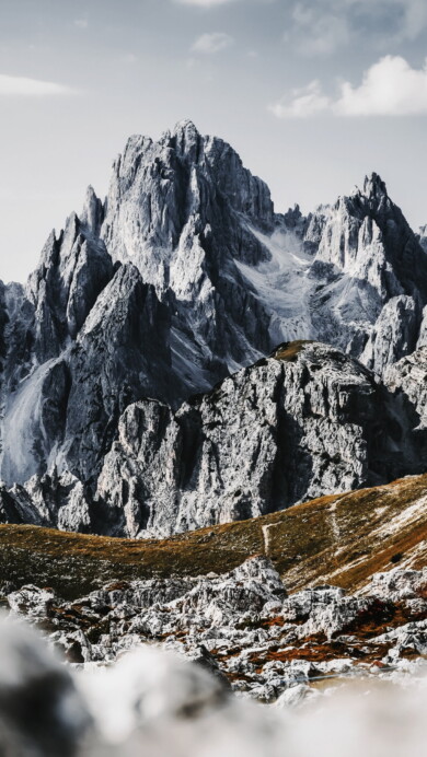 Immerse yourself in the serene beauty of the Cadini di Misurina Mountains in Italy's Dolomites with this mesmerizing 4K wallpaper. The alpine beauty and rugged landscape of South Tyrol create a tranquil and scenic escape. Perfect for travelers and those seeking a desktop background that captures the natural wonder and serenity of these majestic mountains.