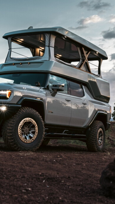 An impressive 4K wallpaper featuring the 2024 GMC Hummer EV EarthCruiser, a remarkable electric vehicle designed for off-road adventures. Perfect for showcasing the rugged luxury of this pickup truck on your desktop or mobile screen.