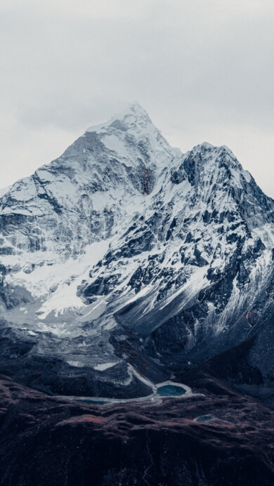 Immerse yourself in the majesty of Mount Everest, the world's tallest mountain, with this breathtaking 4K wallpaper. Located in the Himalayas of Nepal, this iconic peak is a symbol of outdoor adventure and natural wonder. Perfect for travelers and those seeking a desktop background that captures the awe-inspiring beauty of the world's highest mountain.