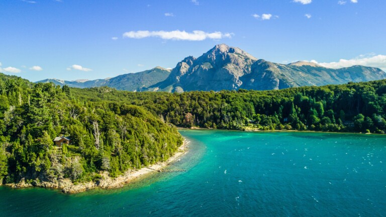 Journey to the pristine beauty of Nahuel Huapi Lake in Argentina's Patagonia region with this mesmerizing 4K wallpaper. Set against the backdrop of the Andes Mountains, the lake offers a serene and scenic escape. Ideal for travelers and those seeking a desktop background that captures the natural tranquility and awe-inspiring landscape of South America.