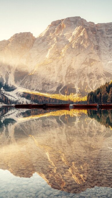 Immerse yourself in the serene beauty of Pragser Wildsee Lake in Italy's South Tyrol region with this captivating 4K wallpaper. The alpine lake, surrounded by the stunning landscape of South Tyrol, offers a tranquil and scenic escape. Perfect for travelers and those seeking a desktop background that captures the natural tranquility and alpine wonder of this Italian gem.