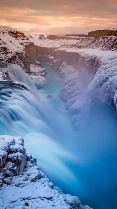 Immerse yourself in the natural wonder of Iceland with this breathtaking 4K wallpaper featuring a mesmerizing waterfall. It's the perfect choice for your high-resolution desktop background, capturing the scenic beauty of this Nordic island.