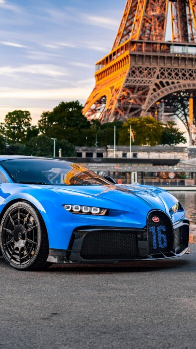 A striking 4K wallpaper showcasing the Bugatti Chiron Pur Sport in Paris. This high-resolution image captures the essence of the luxurious hypercar against a backdrop of the iconic Parisian landscape. Ideal for your desktop or device background.