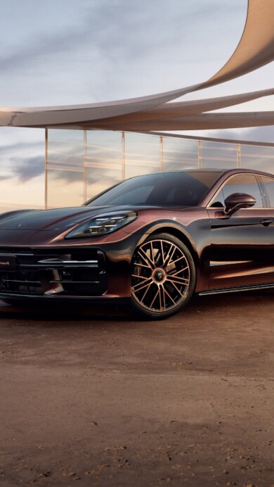 A sleek and powerful 4K wallpaper showcasing the Porsche Panamera Turbo E-Hybrid Sonderwunsch. This high-resolution image captures the dynamic elegance of the luxury sports car, making it an ideal choice for enthusiasts looking to enhance their desktop or mobile display with the sophistication and performance of Porsche engineering.