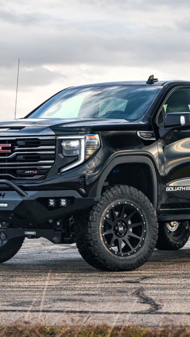 A striking 4K wallpaper featuring the powerful GMC Sierra, a robust and rugged American pickup truck. The high-resolution image showcases the truck's impressive design, making it an ideal choice for enthusiasts to adorn their desktop or mobile screens with the essence of automotive excellence.