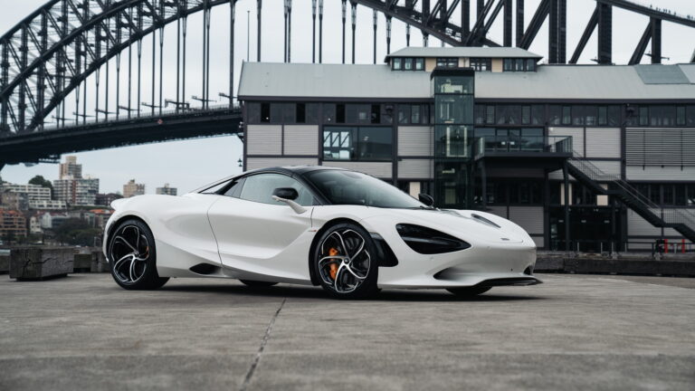 stunning 4K wallpaper featuring the McLaren 750S Spider, a pinnacle of automotive luxury and high performance. This sleek supercar is showcased against a backdrop of dynamic energy, making it the perfect choice for your desktop or mobile wallpaper.