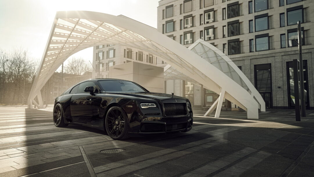 A sophisticated 4K wallpaper featuring the Spofec Rolls-Royce Wraith Black Badge Overdose, a pinnacle of luxury and sleek automotive design. The high-resolution image captures the essence of this exotic masterpiece, making it a perfect choice for your desktop or mobile background.