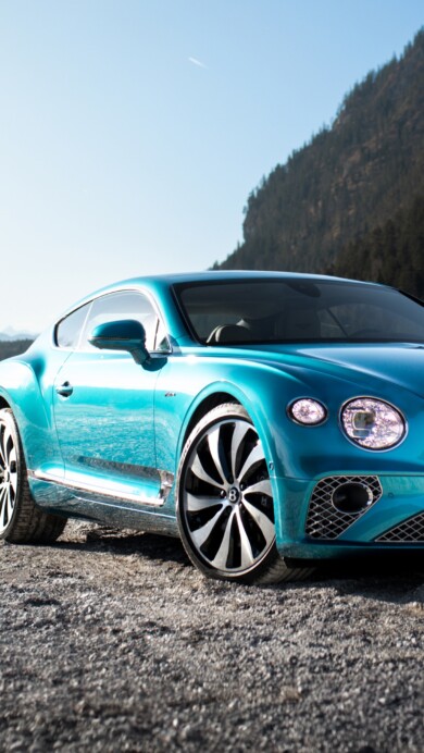 A sophisticated 4K wallpaper featuring the 2024 Bentley Continental GT Mulliner, showcasing its luxurious design in high resolution. The sleek lines and elegant details of this high-end automobile make it an ideal choice for your desktop or mobile background.