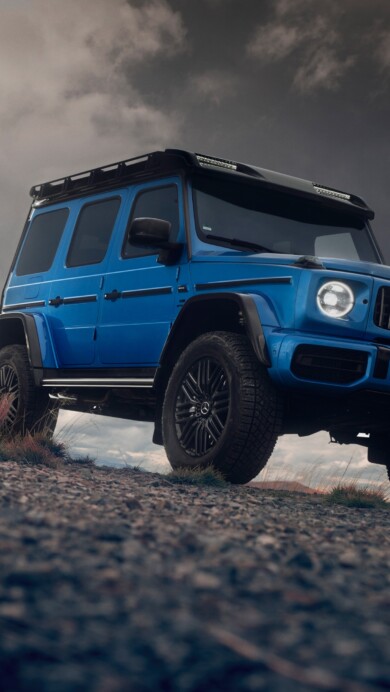 A mesmerizing 4K wallpaper featuring the luxurious Mercedes AMG G63 in a striking shade of blue. This high-resolution image showcases the perfect blend of elegance and power, making it an ideal choice for automotive enthusiasts.