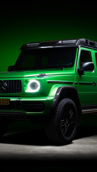 A stunning 4K wallpaper featuring the powerful Mercedes AMG G63 in an eye-catching green hue. The high-resolution image showcases the luxury off-road vehicle, highlighting its stylish design and commanding presence.