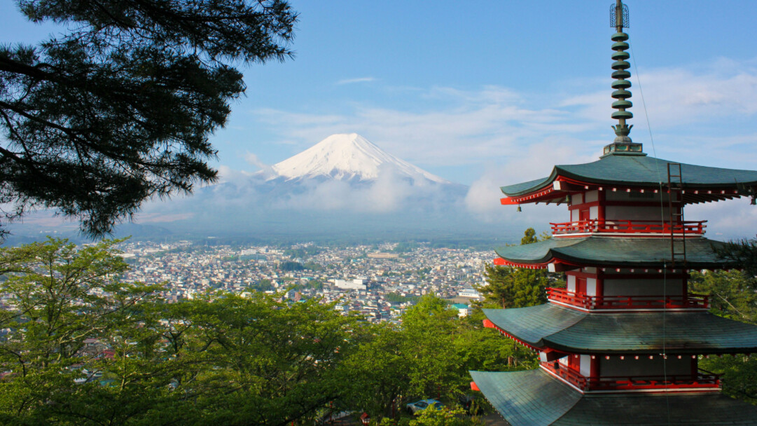 A stunning 4K wallpaper featuring the majestic Mount Fuji with a traditional Japanese pagoda in the foreground. This breathtaking scene captures the serene beauty of Japan's iconic mountain and architecture, making it an ideal backdrop for your desktop or mobile device.