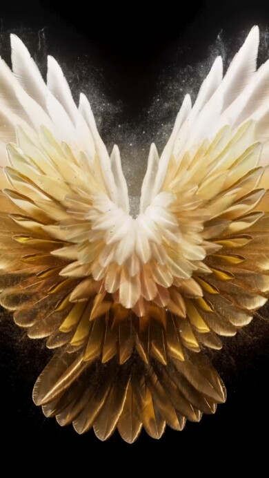 A captivating 4K wallpaper featuring golden yellow angel wings set against a soft background. The detailed wings exude a warm, radiant glow, creating an ethereal and uplifting visual experience perfect for desktop or mobile use.