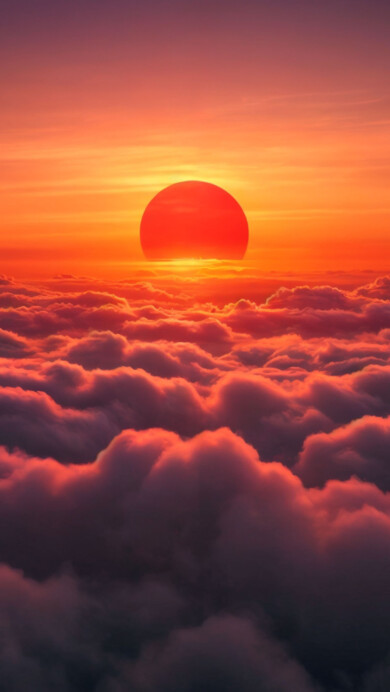 A stunning 4K wallpaper featuring a radiant golden sun casting its warm glow over a vast sea of clouds. The soft, billowing clouds contrast beautifully with the sun’s brilliant hues, creating a breathtaking and serene atmosphere perfect for your desktop or mobile background.