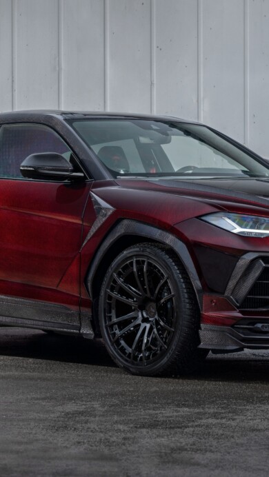 A stunning 4K wallpaper featuring the Lamborghini Urus R’Evo Stealth Edition in a sleek matte black finish. The high-performance SUV is showcased with aggressive styling and dynamic lighting, perfect for automotive enthusiasts and luxury car lovers.